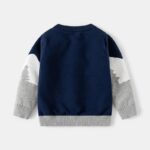 Back view of kids polar bear Christmas jumper in navy with grey and white patterned sleeves and ribbed trims.