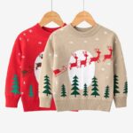 Kids Santa Sleigh Christmas Jumper Red and beige kids Christmas jumpers with Santa sleigh and reindeer designs, snowflakes and festive Christmas trees.