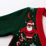 Close up of Santa Claus knitted pattern on kids Christmas cardigan