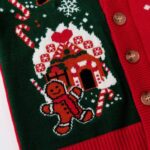 Close up of gingerbread house and gingerbread man knitted Christmas cardigan design