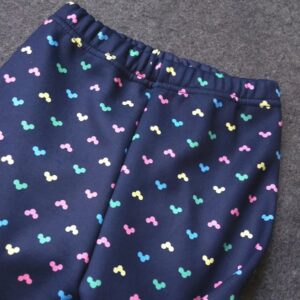 Home - Fabulous Bargains Galore Close-up of navy blue bubble dot fleece leggings for girls showing the elasticated waistband and colourful print.
