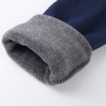 Close-up of denim navy classic leggings for girls showing the thick soft grey fleece lining